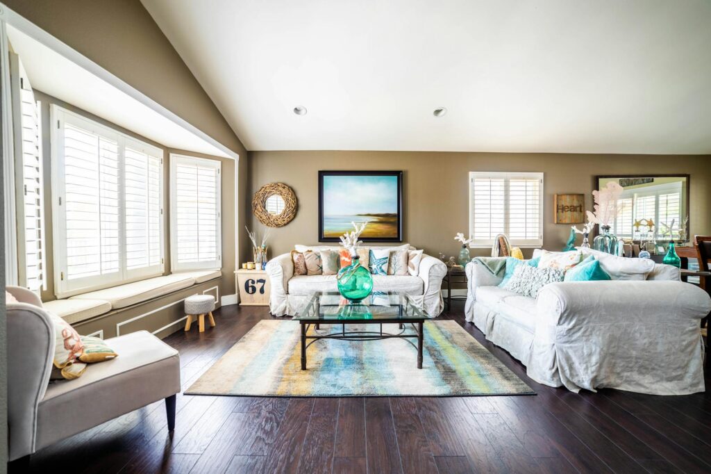 Budget-refreshed living room with painted door, new hardware, and chalk-painted furniture